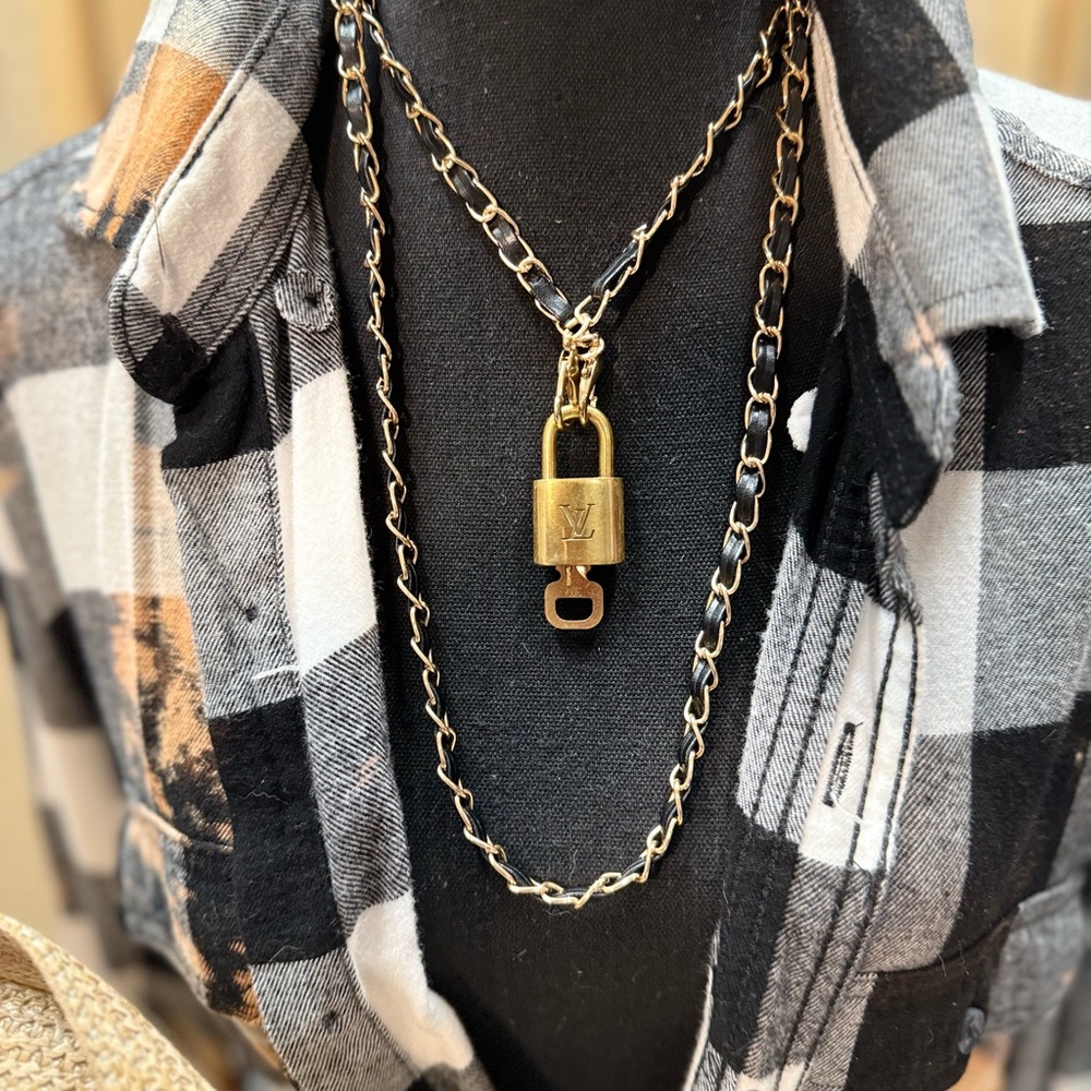 Authentic LV lock on black & gold chain. I have 5  on different chains.